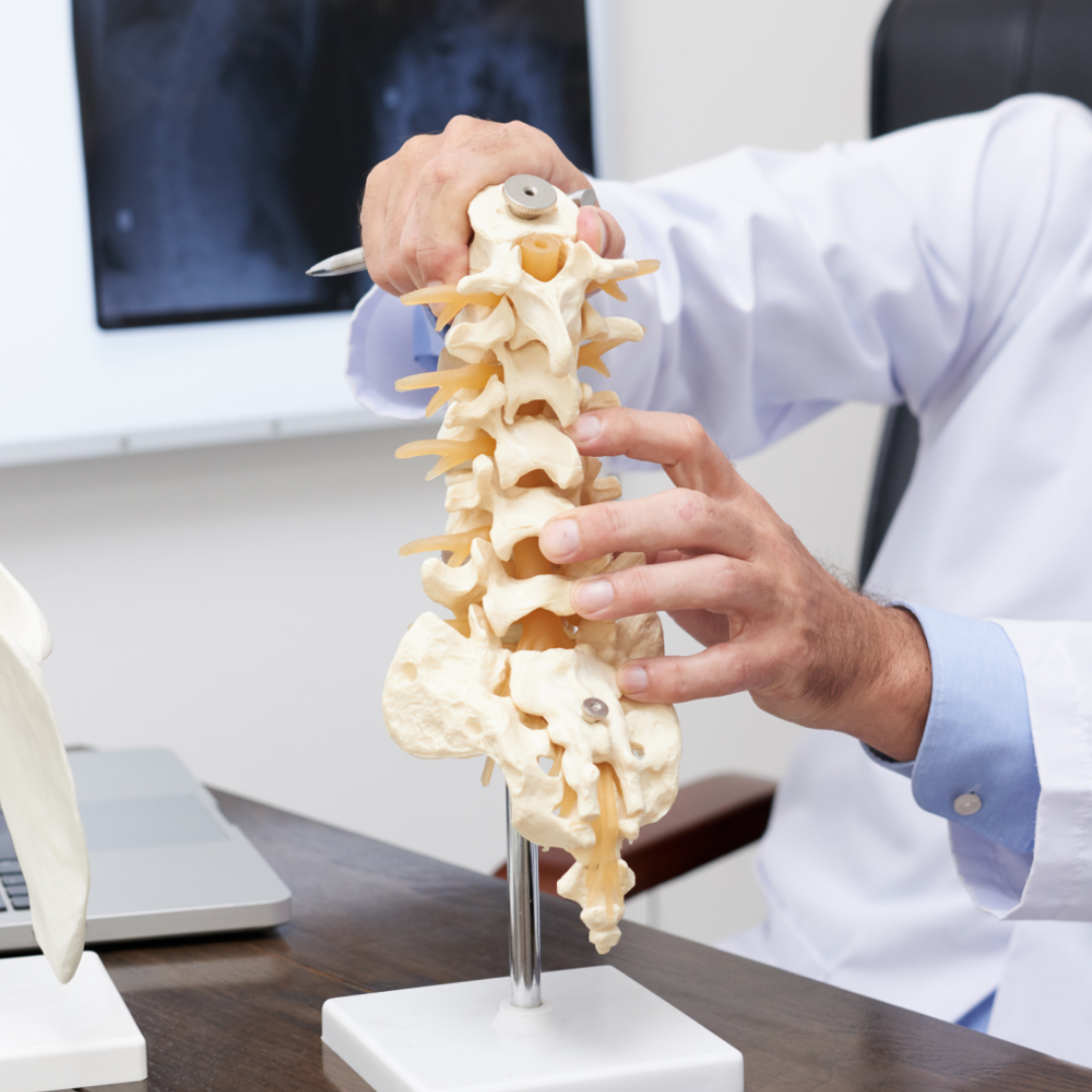 Doctor helping old lady with back pain